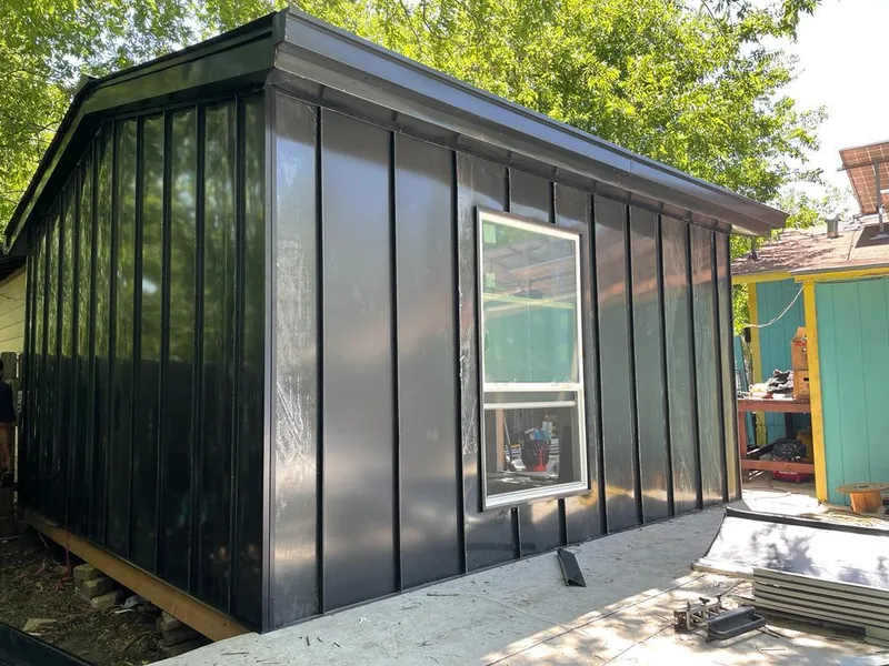 Black standing seam metal wall panels for Roof Inspection in Helotes