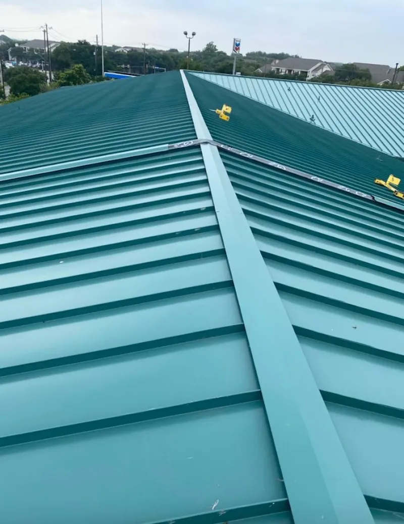 Green commercial metal roof ridge and valley for Metal Roof Repair in Helotes
