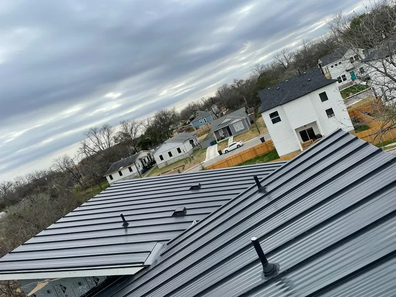 Standing seam metal roof panels with vents for Skylight Repair in Helotes